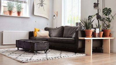 black two-seat sofa and coffee table inside room