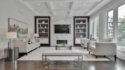 white wooden coffee table near white sofa